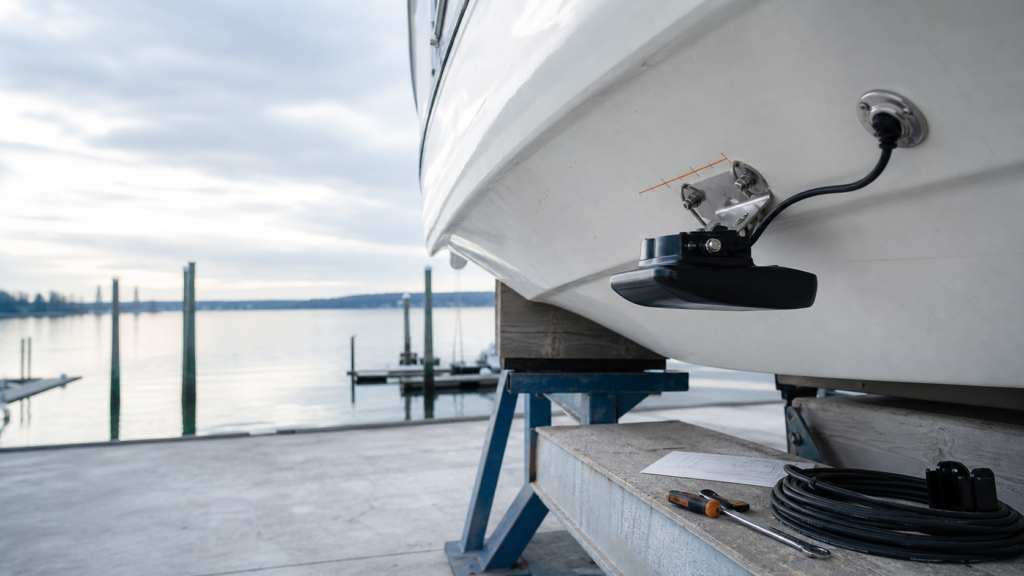Generic marine transducer planned against the underside of a boat hull.